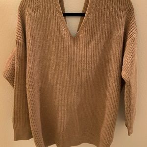 Oversized brown sweater. Knotted in back